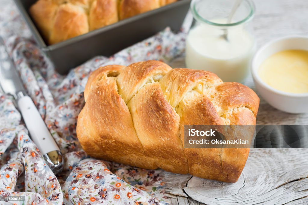 brioche on a light wooden background Bread Stock Photo