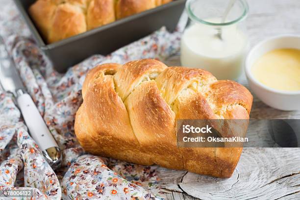 Brioche On A Light Wooden Background Stock Photo - Download Image Now - Bread, Brioche, Milk