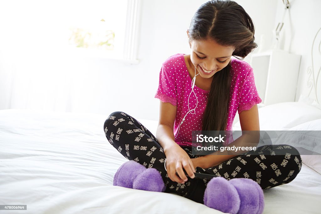 Listening to her favorite band in her bedroom Shot of a girl in her bedroomhttp://195.154.178.81/DATA/i_collage/pu/shoots/804979.jpg 2015 Stock Photo