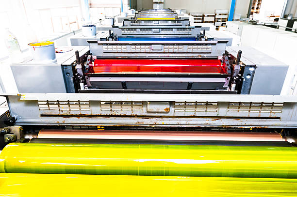 Printing Rollers of a CMYK Industrial 8-Colours Lithograph Printer stock photo