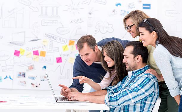 istock Group of creative business people with a laptop 478007148