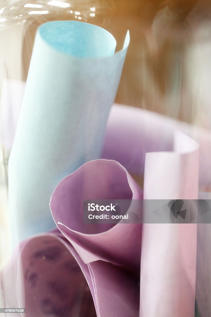 Rolls of papers and notes in a glass container Paper Stock Photo