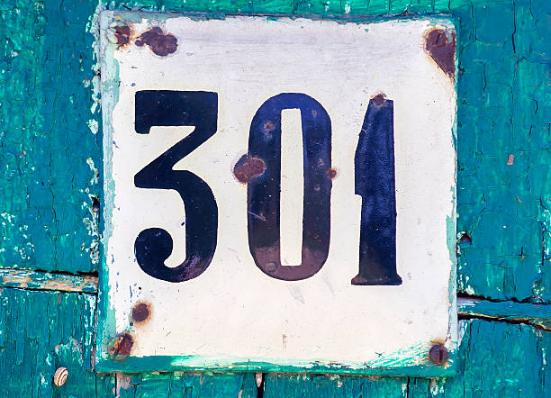 istock Old scratched metal plate with the number three hundred one 478010498