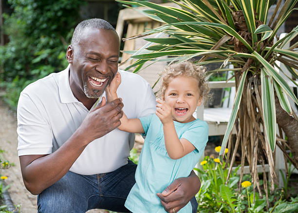 istock Grandfather and granddaughter laughing 478011115