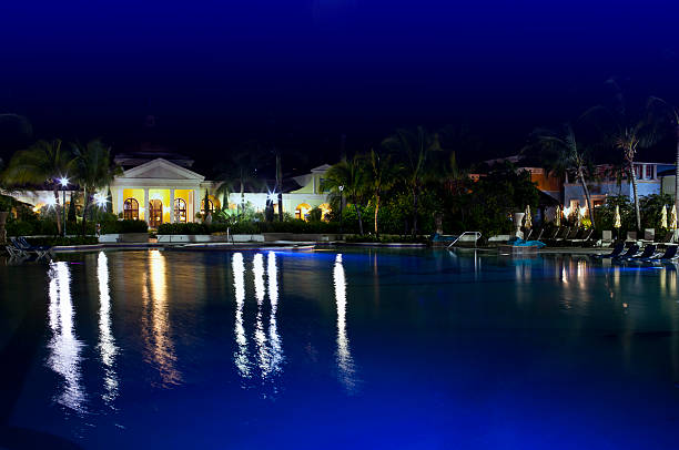 istock Buildings with night illumination behind pool 478011442
