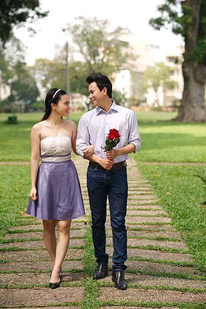istock Couple walking in park 478012264