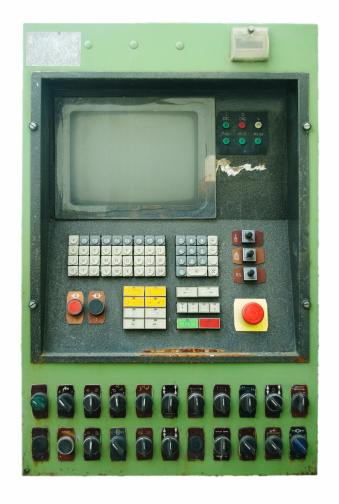 Vintage old cnc control panel with monitor and keyboard