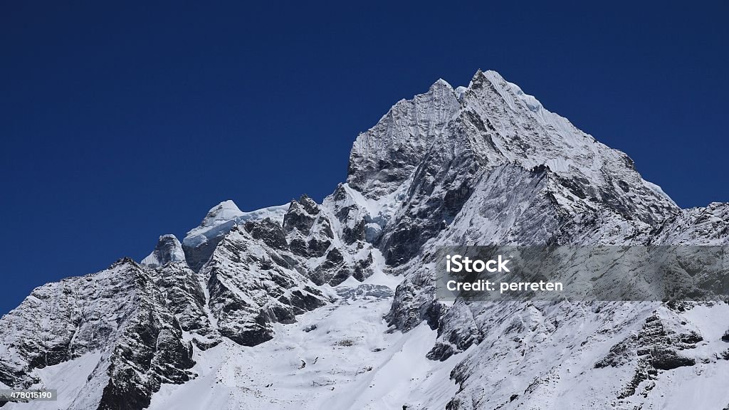 Snow covered Thamserku Snow covered Thamserku, view from Namche Bazar. 2015 Stock Photo