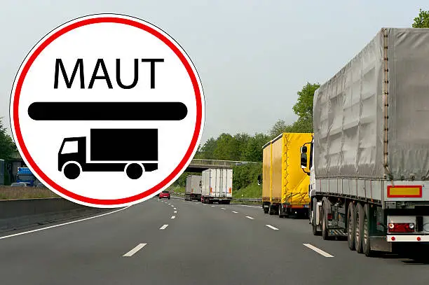 Photo of German traffic sign at a highway with toll for trucks