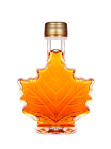 Maple syrup Maple Syrup Bottle Isolated On A White Background maple syrup stock pictures, royalty-free photos & images