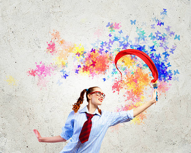 istock Young woman with paint brush 478017123