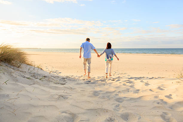 istock Happy mature couple outdoors on the beach 478017224