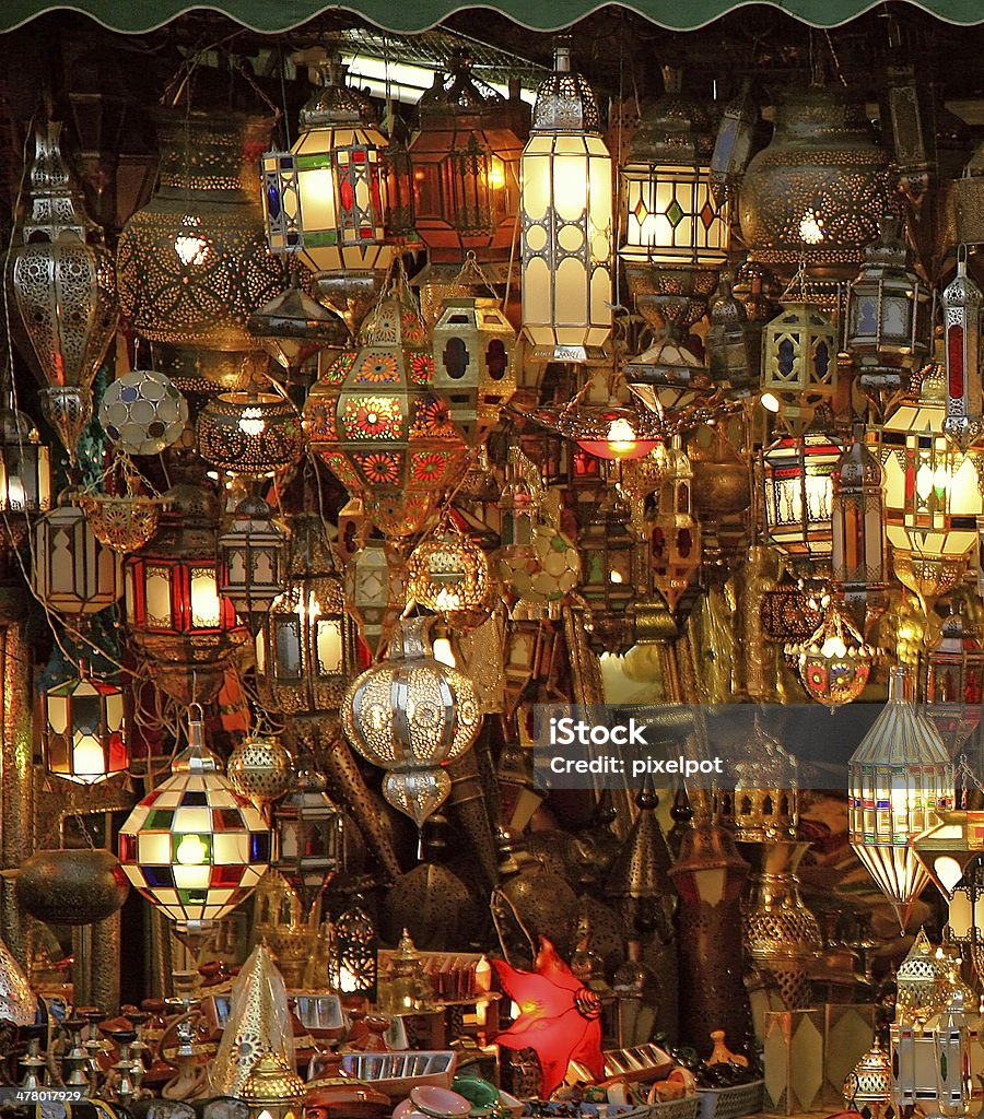 Arabian lights market stall selling a variety of traditional Moroccan lights which are lit Marrakesh Stock Photo