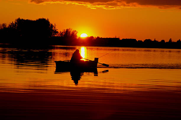 istock beautiful sunset with boat in the lake 478020201
