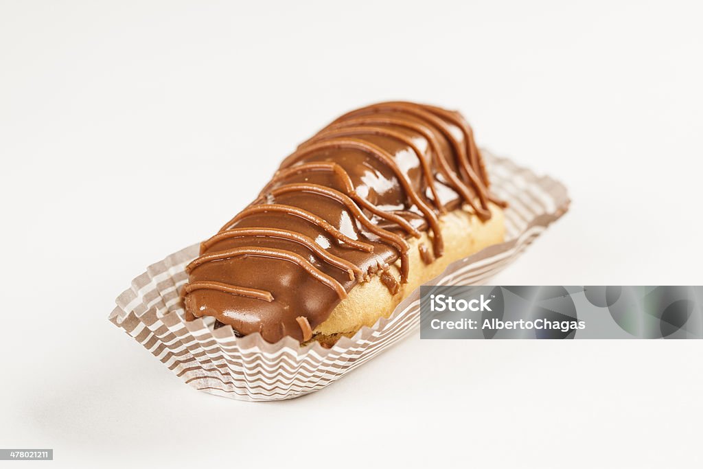 Chocolate bomb. Bomba de chocolate. A Brazilian traditional eclair on a white background. Baked Stock Photo