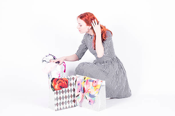 istock Woman looking at shopping bags 478021364