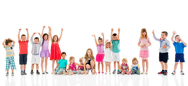 istock Large group of happy children with hands raised. 478021924