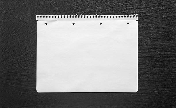 istock White paper sheet on black background. School book page 478022204