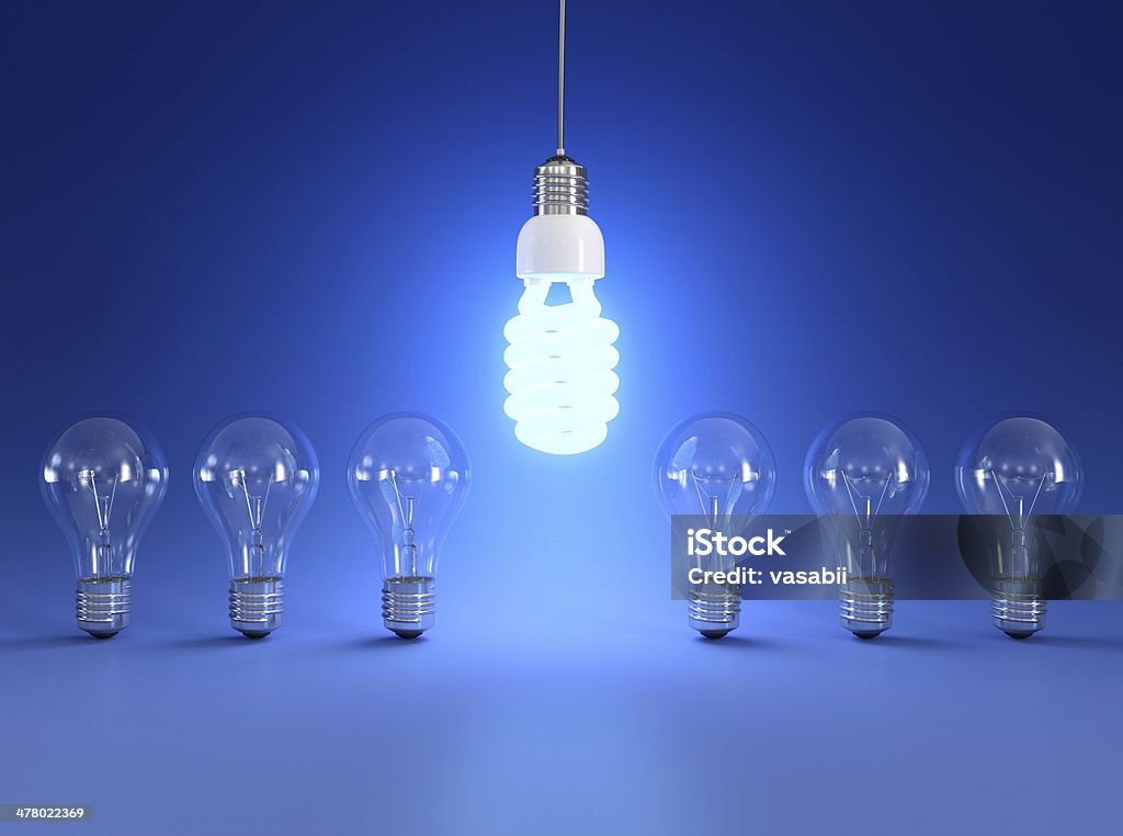 Energy saving light bulb Energy saving and simple light bulbs isolated on blue background. Backgrounds Stock Photo