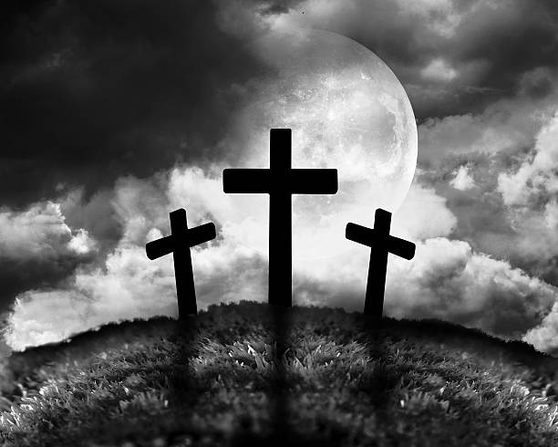 istock Silhouette of three crosses on a hill 478022523
