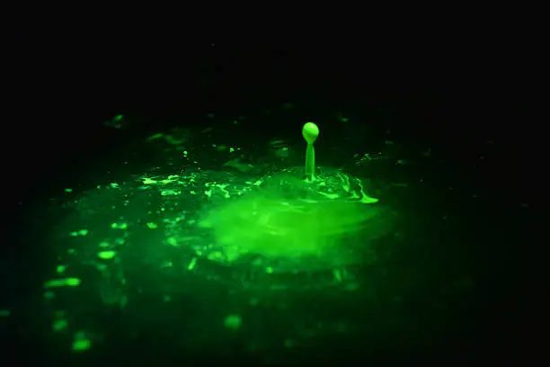 Radioactive florescent drops in water
