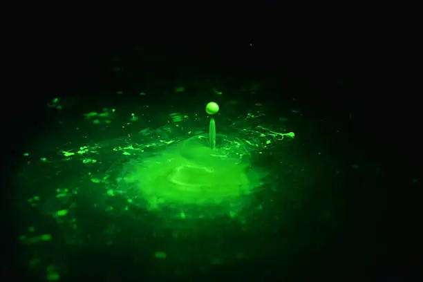 Radioactive florescent drops in water