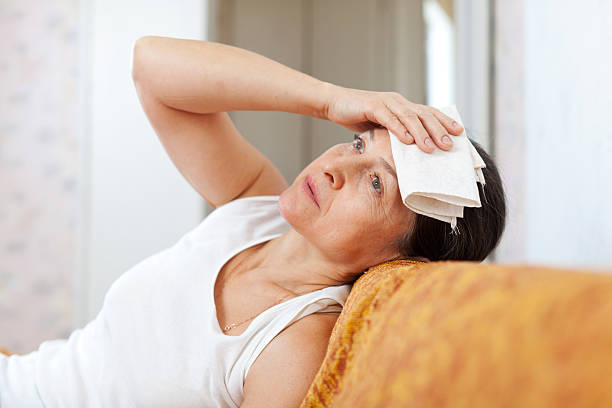 istock sick mature woman 478025583