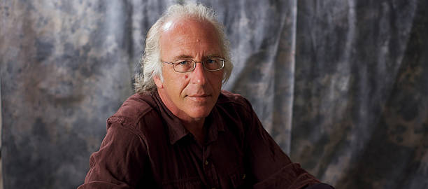 istock blue eyed man with glasses and grey hair 478029962