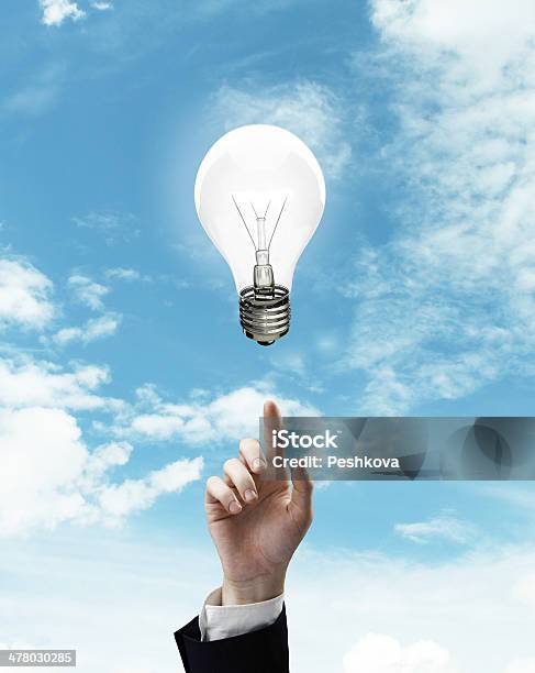 Hand Pointing At Lamp Stock Photo - Download Image Now - Aiming, Close-up, Electric Lamp