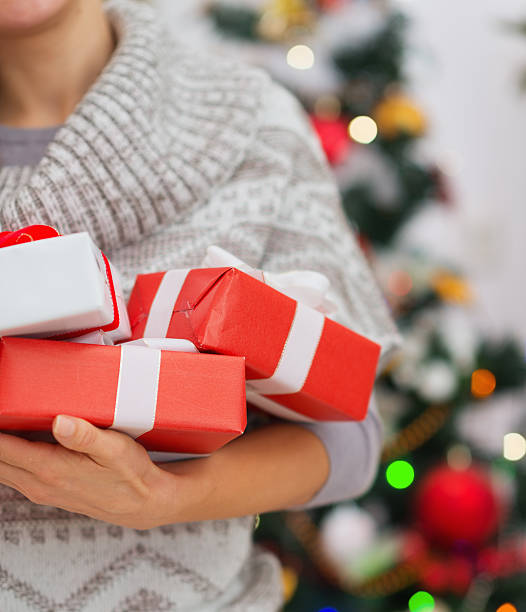 istock Closeup on Christmas present boxes in woman hands 478031915