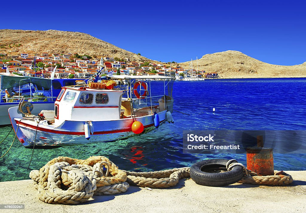 traditional Greece , Dodecanese islands colorful sunny island Halki with traditional fishing boats Aegean Sea Stock Photo