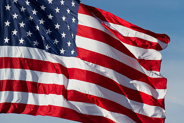 US Flag and Blue Sky stock photo