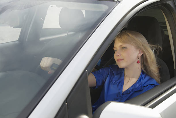 istock Young woman in car 478033071
