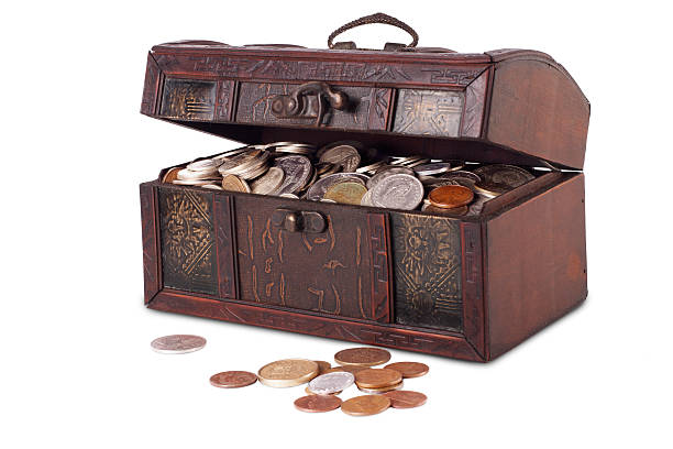 istock Wooden chest with coins inside isolated 478033281