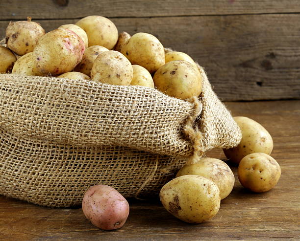 istock fresh organic potatoes on a wooden background 478033535