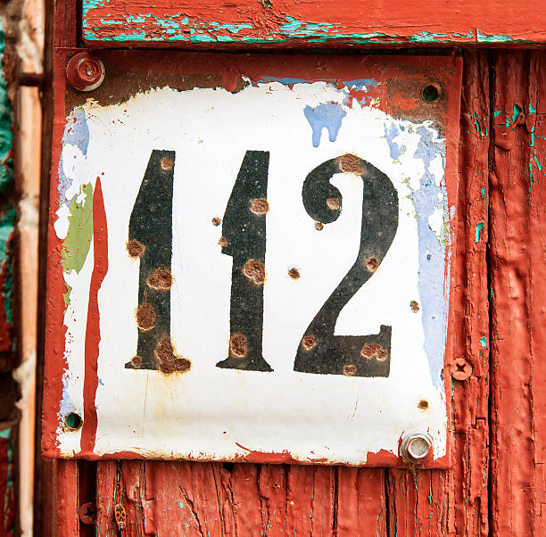 istock Old scratched metal plate with the number one hundred twelve 478036130