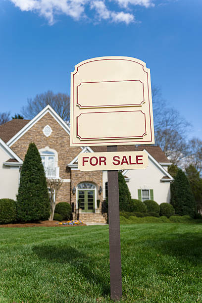 istock For Sale sign in front of a home 478036809