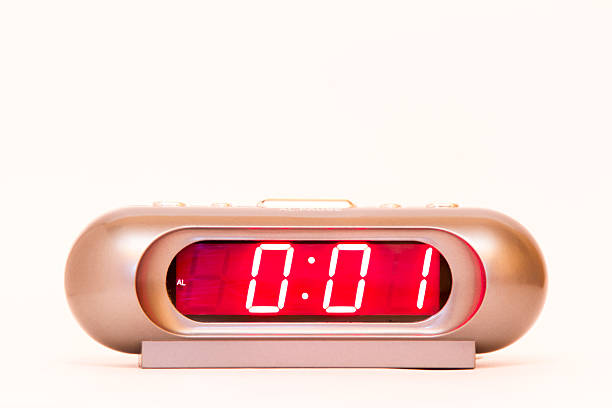 istock electronic clock alarm clock with red illumination and the time 0:01 478038216