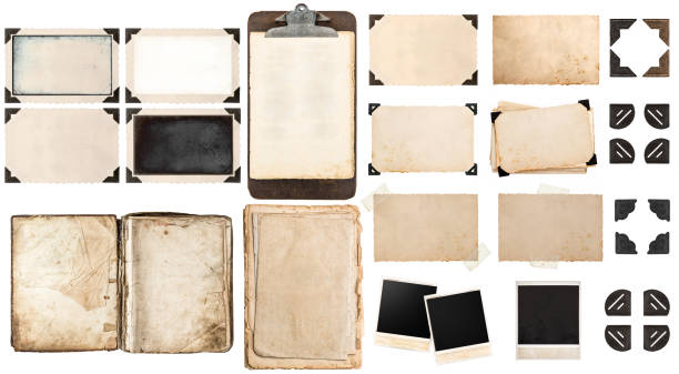 Old paper sheets, book, vintage photo frames and corners, antique clipboard isolated on white background.