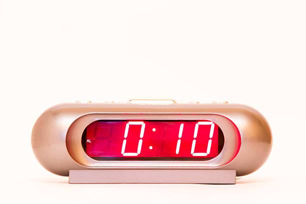 istock electronic clock alarm clock with red illumination and the time 0:10 478038248