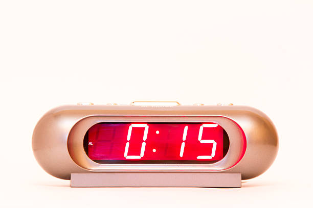 istock electronic clock alarm clock with red illumination and the time 0:15 478038254