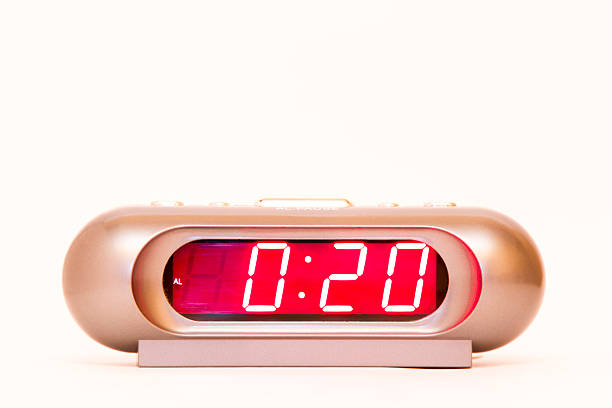 istock electronic clock alarm clock with red illumination and the time 0:20 478038262