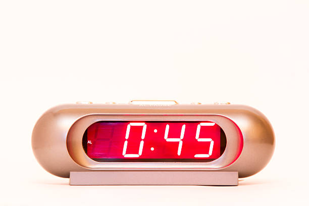 istock electronic clock alarm clock with red illumination and the time 0:45 478038268