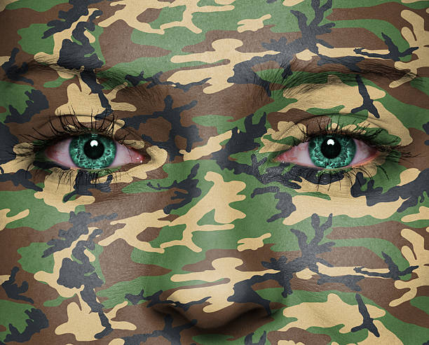 Soldier Woodland camouflage painted on woman a face - army concept female sharp shooter stock pictures, royalty-free photos & images