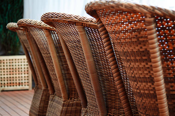istock Four brown woden rattan armchairs 478038584