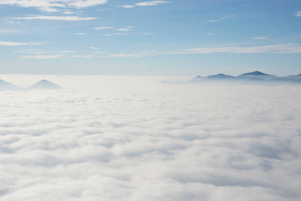 Sea of fog over an alpine lake stock photo