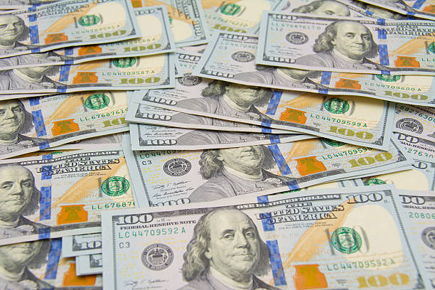 istock Background with money american hundred dollar bills - horizontal 478042104