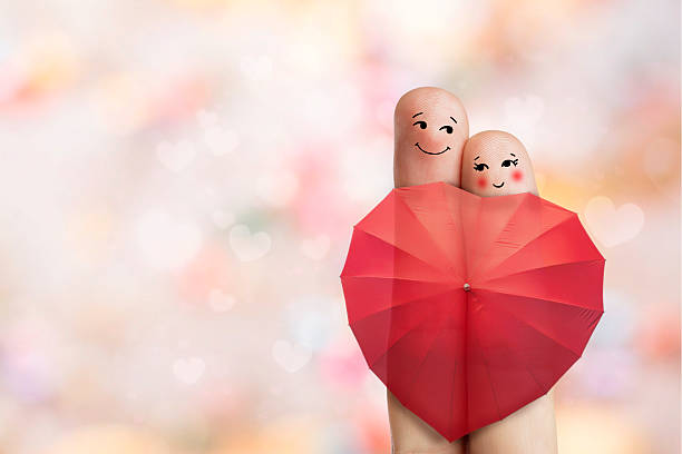 istock Creative finger art. Lovers are embracing and holding red umbrella. 478042576