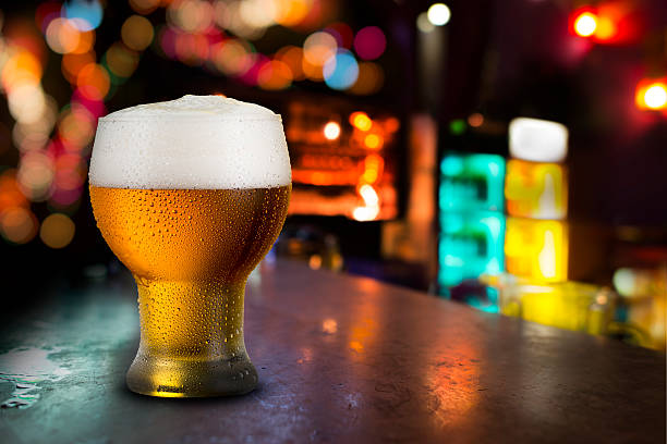 istock Glass of cold beer with bar scene 478046822