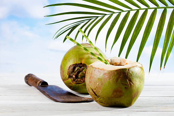 istock Coconut with drinking straws, old cleaver 478049798